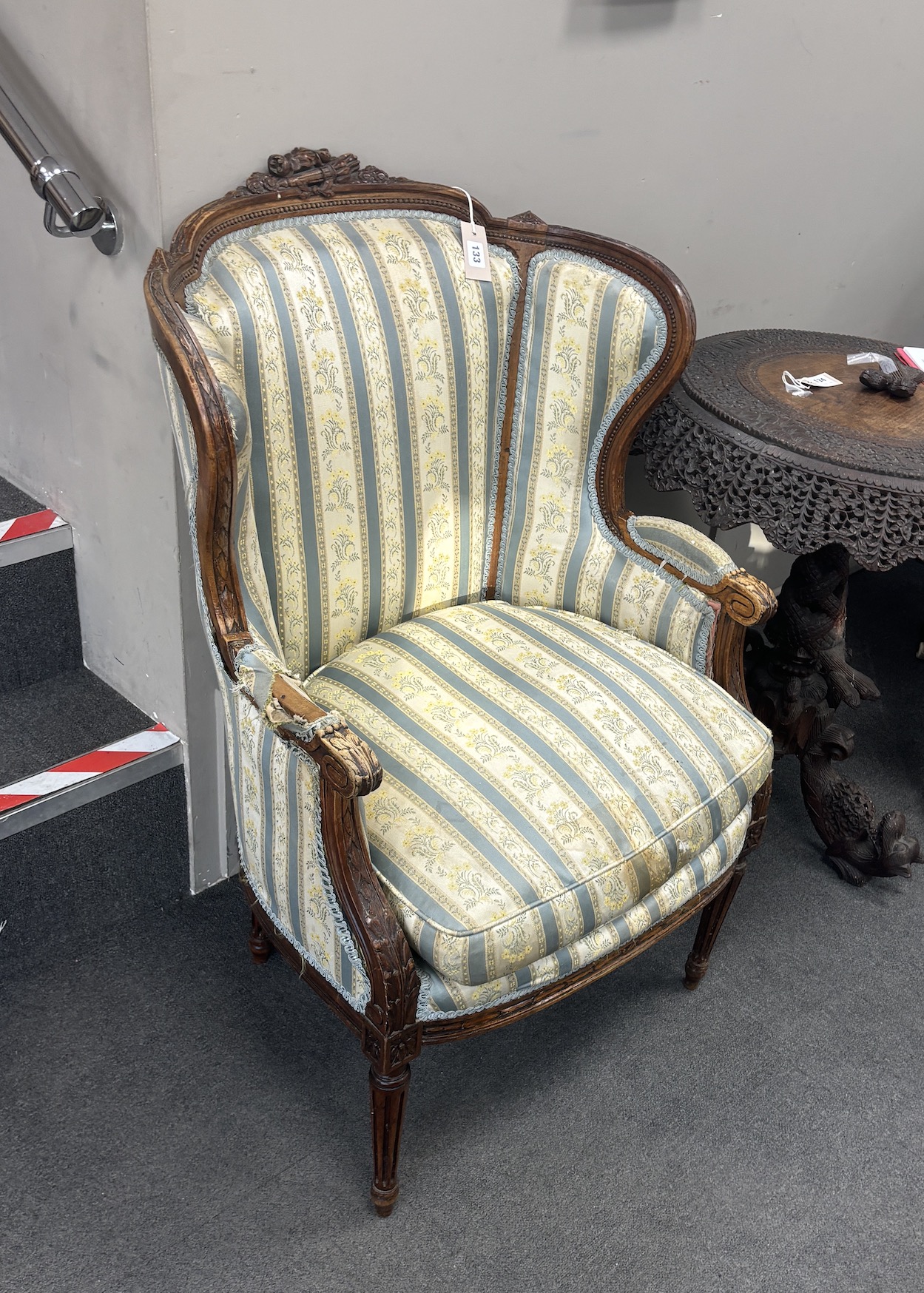 A French carved walnut elbow chair, width 65cm, depth 50cm, height 105cm